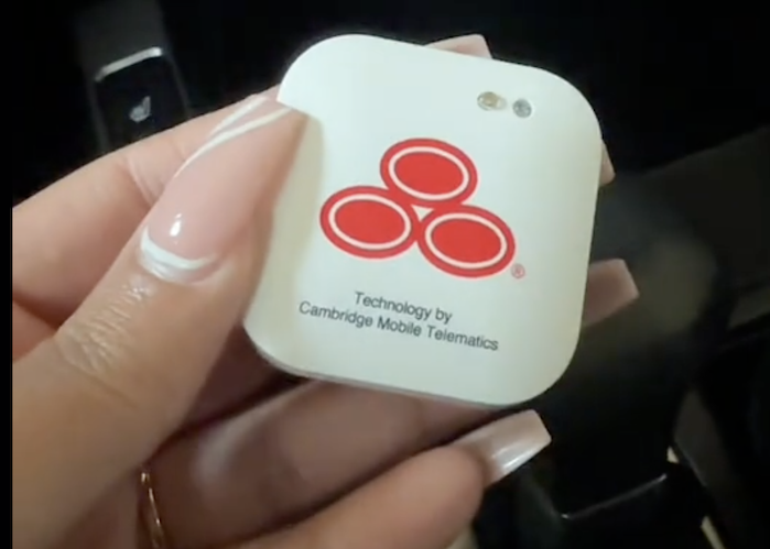 Roderiqua holding a State Farm Insurance beacon