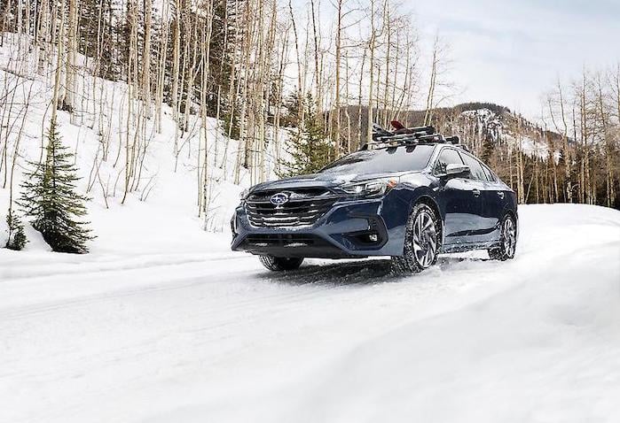 2024 Subaru Legacy driving in the snow