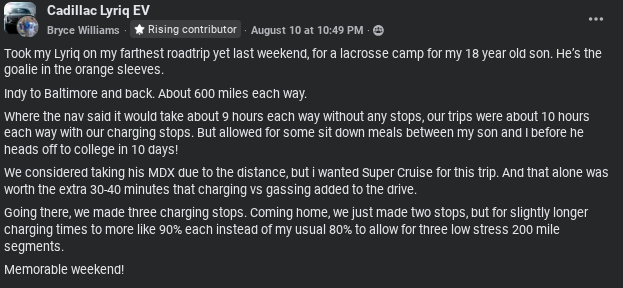 A Cadillac Lyriq EV parked in a scenic area, with a father and son enjoying a weekend road trip to a lacrosse camp.