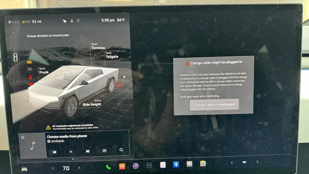 Cybertruck message that charge cable might be plugged in.