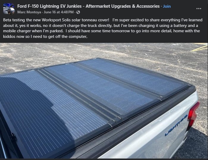 A close-up of a Ford F-150 Lightning truck's solar tonneau cover, showcasing its sleek solar panels under bright sunlight.