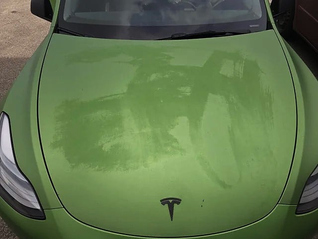 Obvious Damage to Tesla Wrap from Bad Detailing
