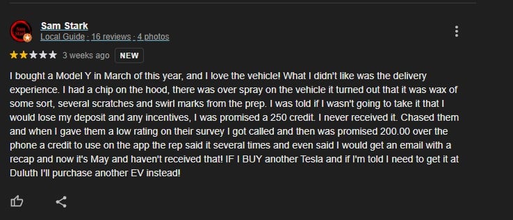 A customer review expressing satisfaction with a Tesla Model Y but frustration with the delivery experience and unfulfilled credit promises.