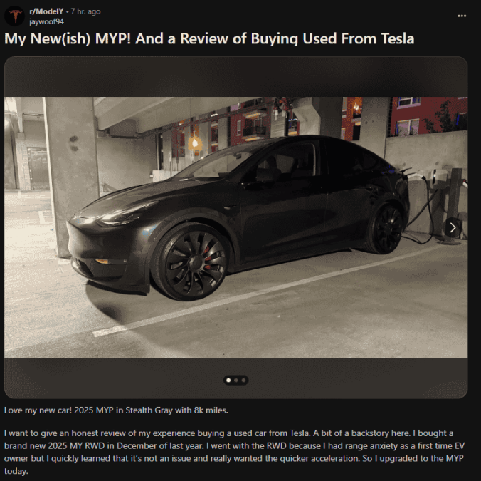 A 2025 Tesla Model Y MYP in Stealth Gray parked, showcasing its black wheels and low mileage of 8k in a well-lit garage.