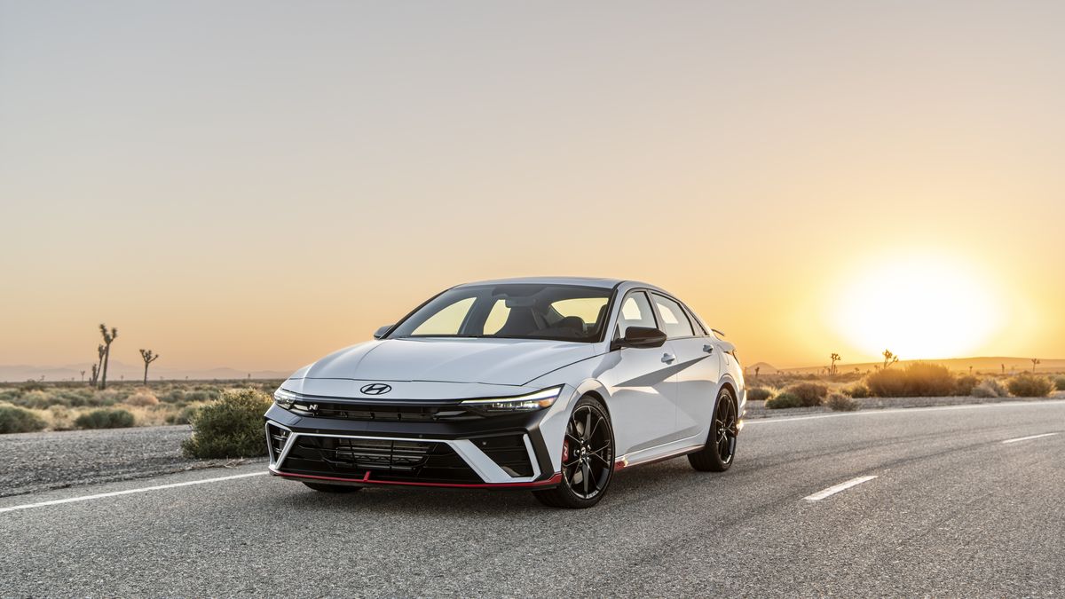 White 2025 Hyundai Elantra N in front of mountains front 3_4 quarters view