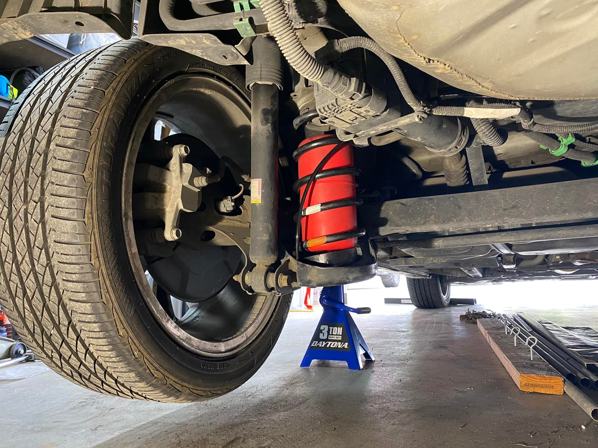 Image shows a Toyota Prius with airbag suspension