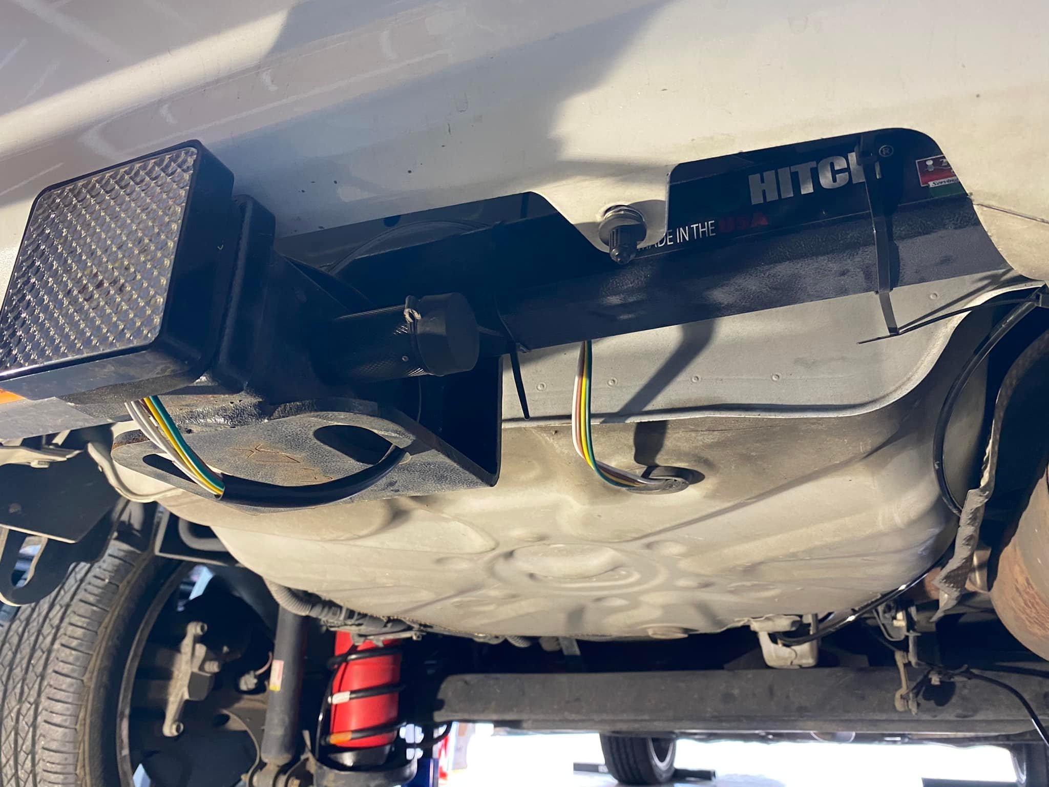 Image shows a Toyota Prius with a trailer hitch