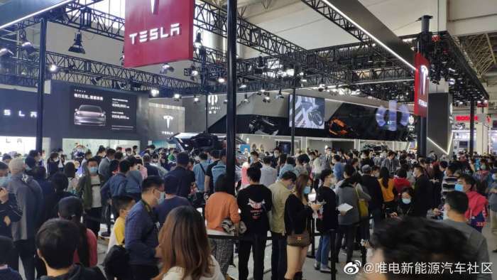 Many People at  Tesla stand At Beijing auto show