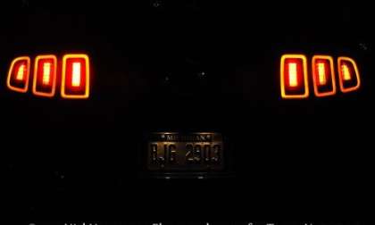 The 2013 Ford Mustang GT Premium Coupe from the rear in the dark