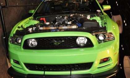 The 2013 Ford Mustang GT in Gotta Have It Green from the front