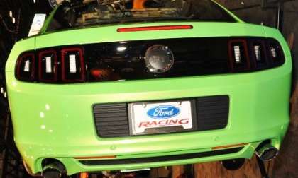 The 2013 Ford Mustang GT in Gotta Have It Green from the rear