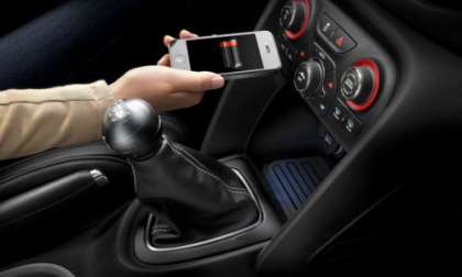 The 2013 Dodge Dart interior with the new charging pad.