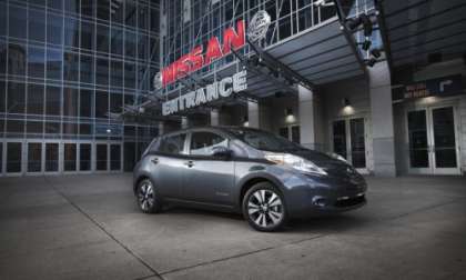 Nissan LEAF in front of Nissan building