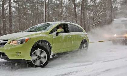 Watch 2014 Subaru XV Crosstrek Hybrid pull out stuck UPS truck