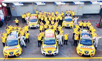 SEAT workers surround racing Leon Supercopas. Photo courtesy of SEAT