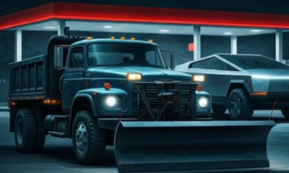 Tesla Cybertruck and a plow truck in a gas station at night