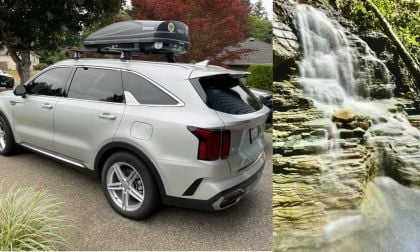 Silver Kia Sorento from the side and small waterfall