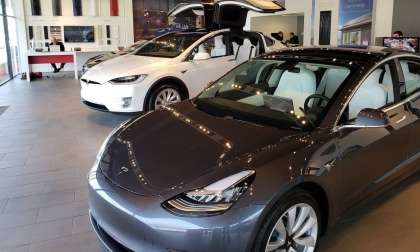 Image of Tesla showroom staffed by men by John Goreham. 