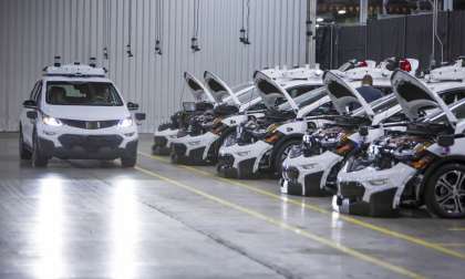 Chevrolet Bolt EV autonomous vehicles wait to be tested.