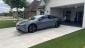 Lucid Air in Driveway, Grey with Green Grass